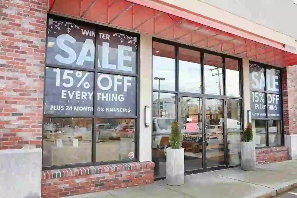 image shows a storefront with "WINTER SALE" signs indicating "15% OFF EVERYTHING" and "PLUS 24 MONTH 0% FINANCING."