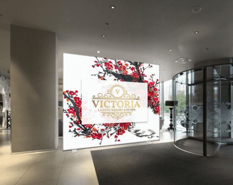 image displays a large, illuminated graphic panel featuring the logo for "Victoria Luxury Resort and Spa."